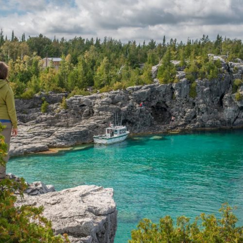 The tall limestone cliffs and turquoise water of the Bruce Peninsula provide a variety of recreational opportunities for residents and visitors alike. Credit: Scott Parker